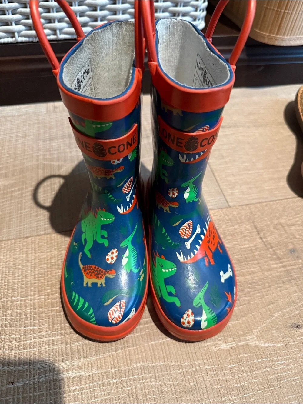 Children's Navy Rain Boot with Colorful Dinosaur Print and Red Trim